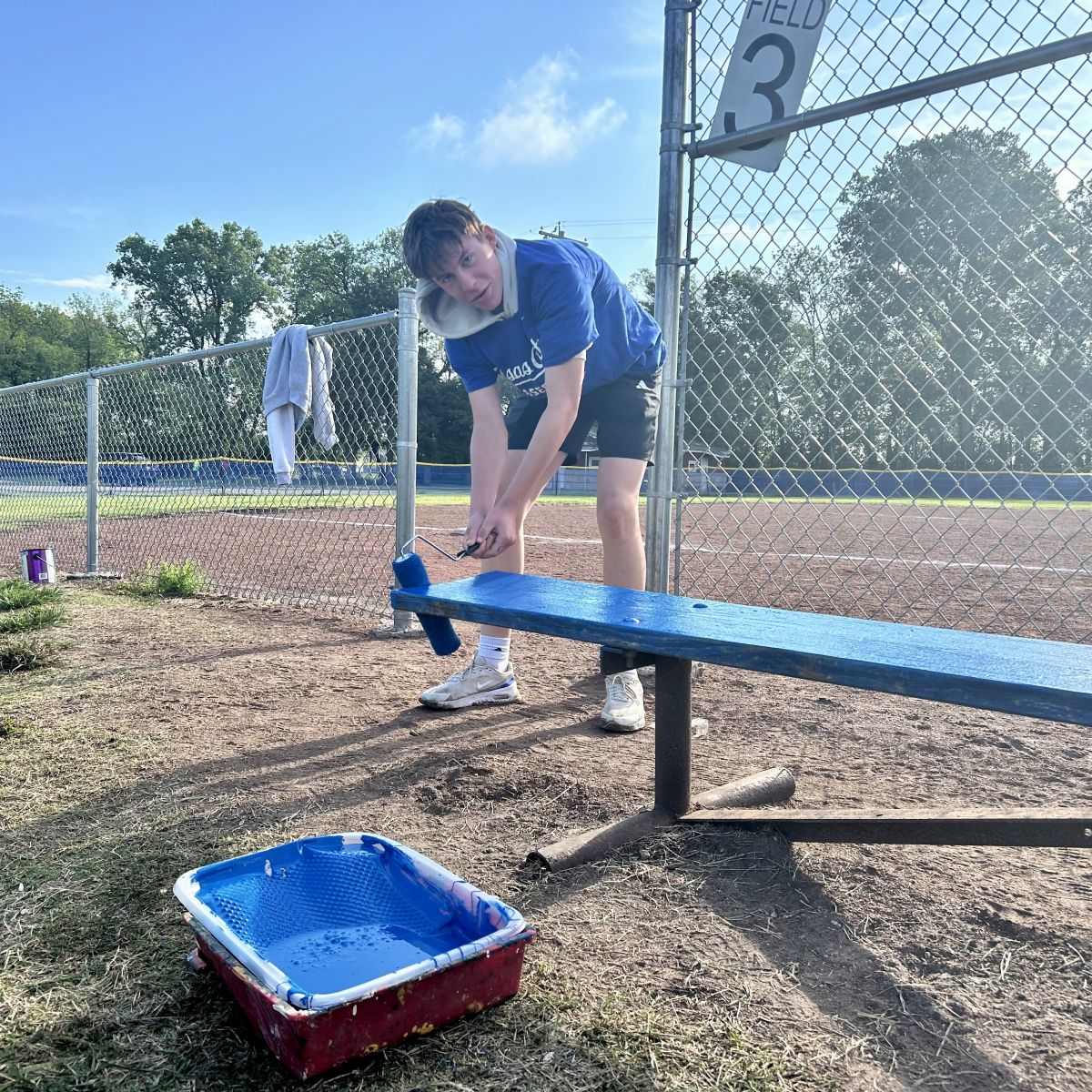 RHS Students painting Ballfield seating
