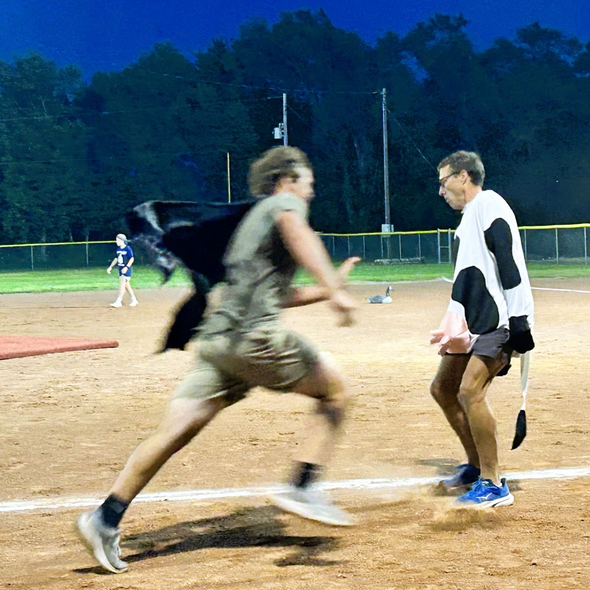 Farmer Derek (dressed as a cow) is blocking the running path of Batman in the Championship Game