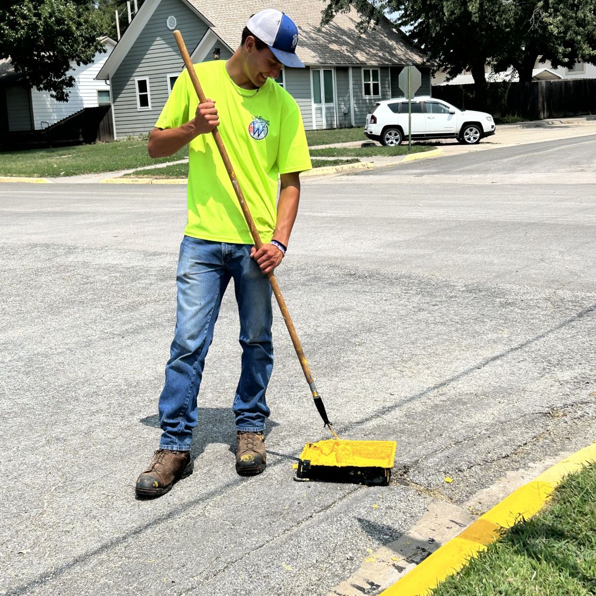 Our summer hire, Nolan Sweazy help paint curbs, mow and so much more.