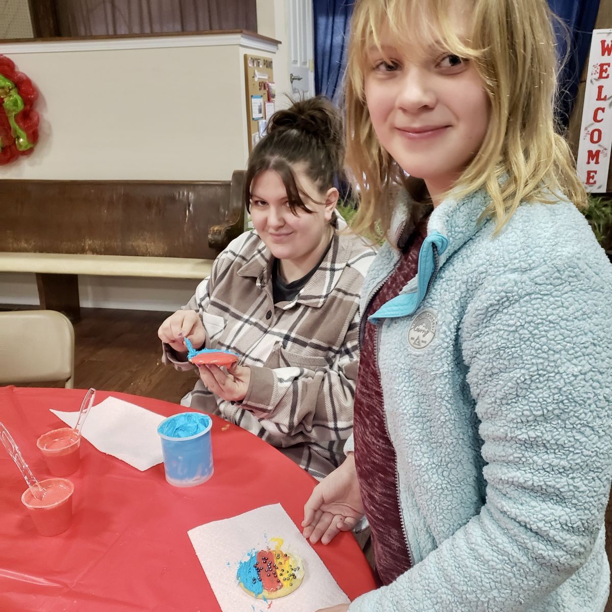 two proud cookie decorators