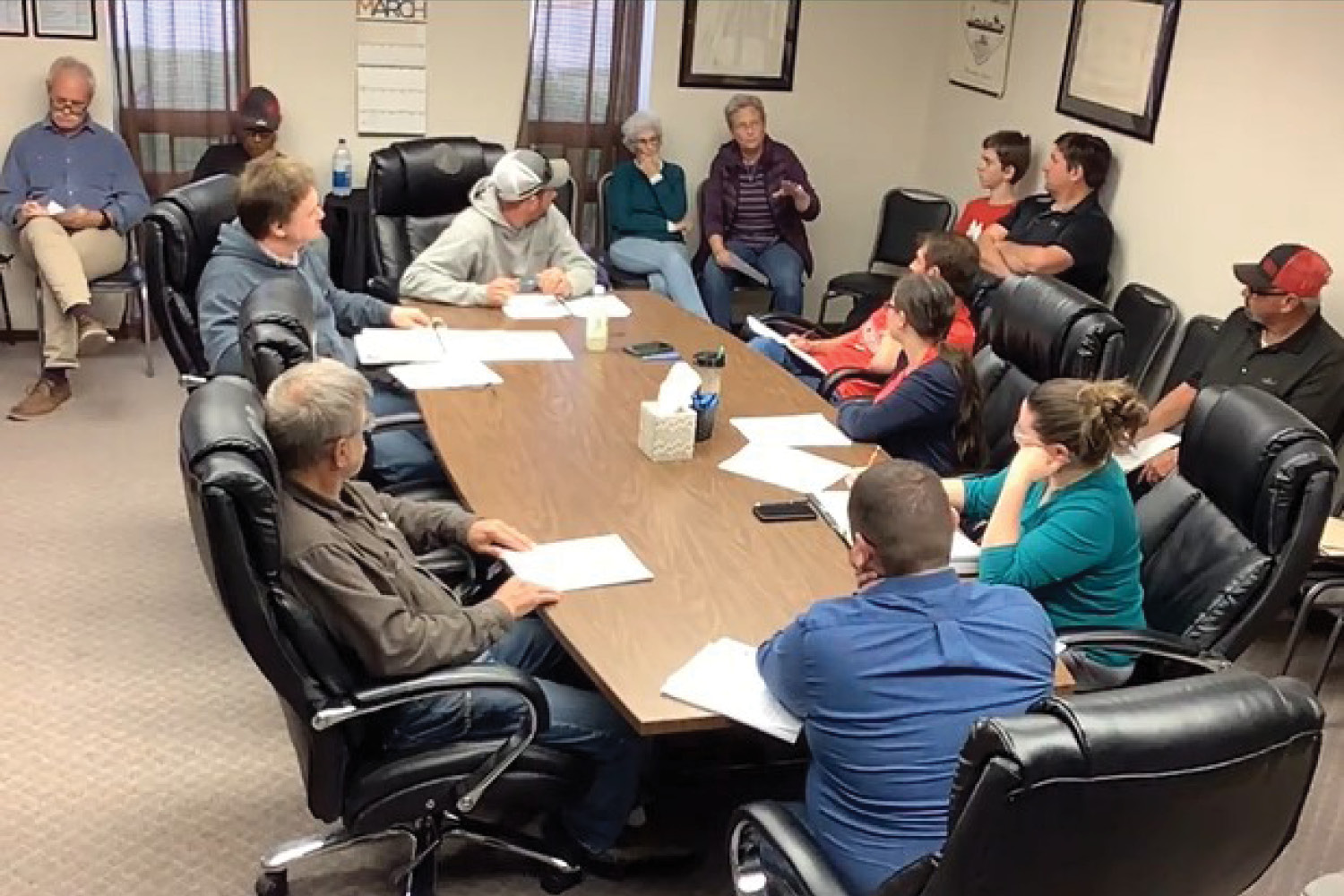 group of people in the city hall in discussion